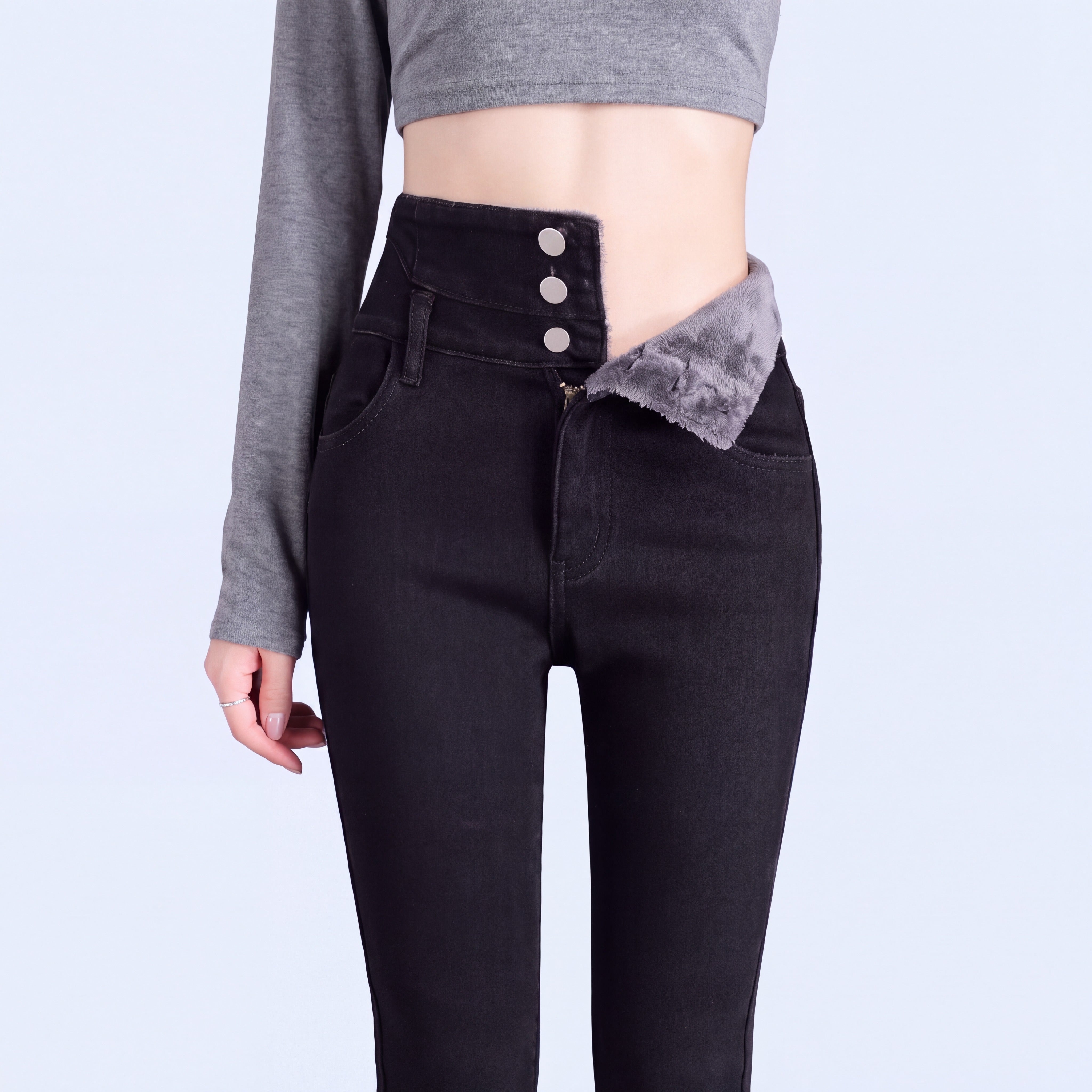 Stella jeans in Black with the waistband folded to show the fleece lining