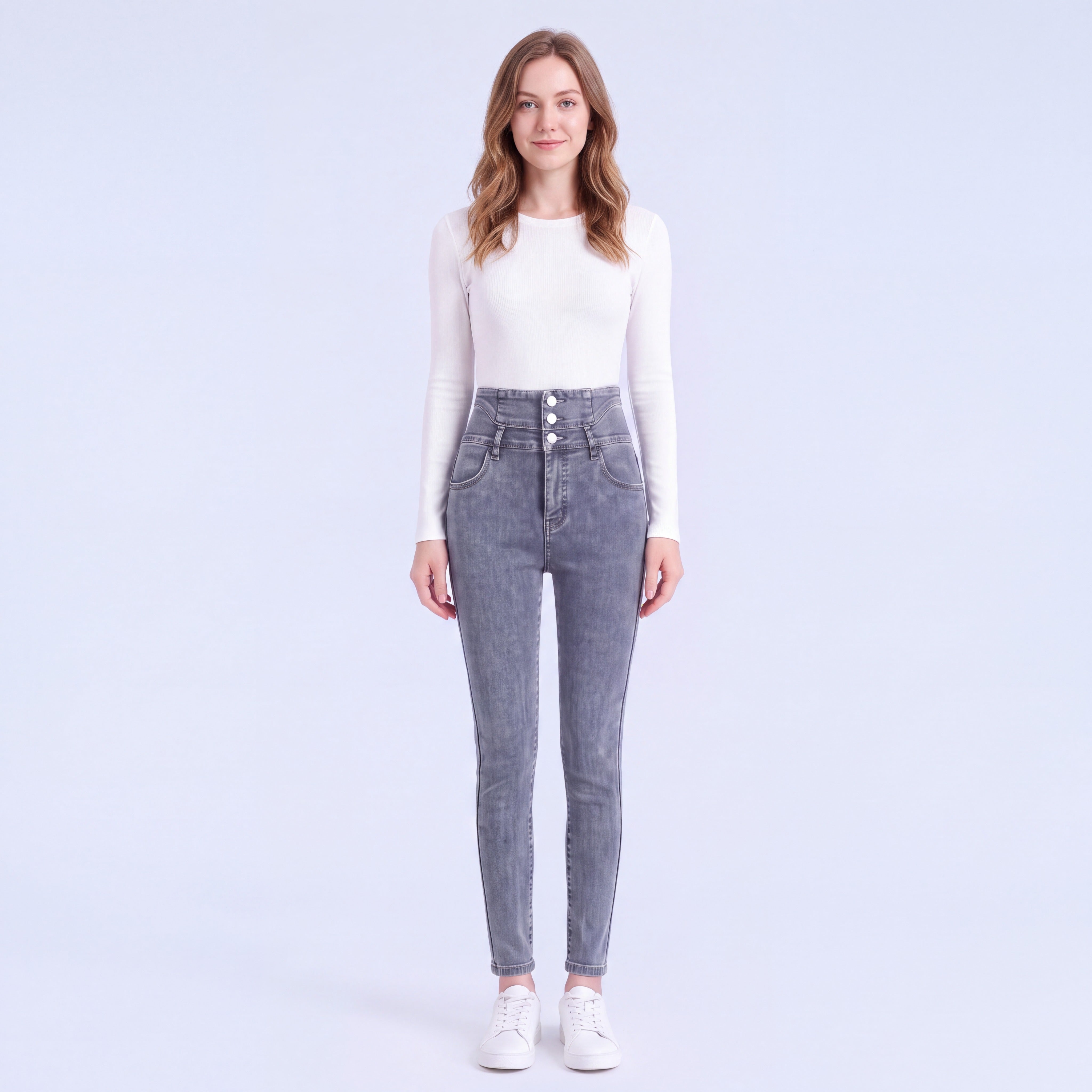 Model wearing Stella fleece-lined high-rise jeans in Blue Gray, full length
